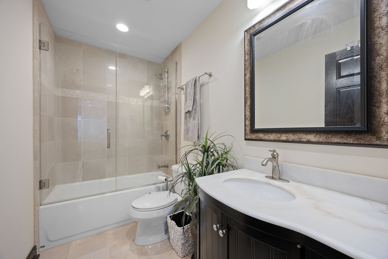 140 Carriage Way Drive, Unit C218 Burr Ridge, IL 60527 - Photo 21 of 33 a bathroom with a sink a toilet and shower