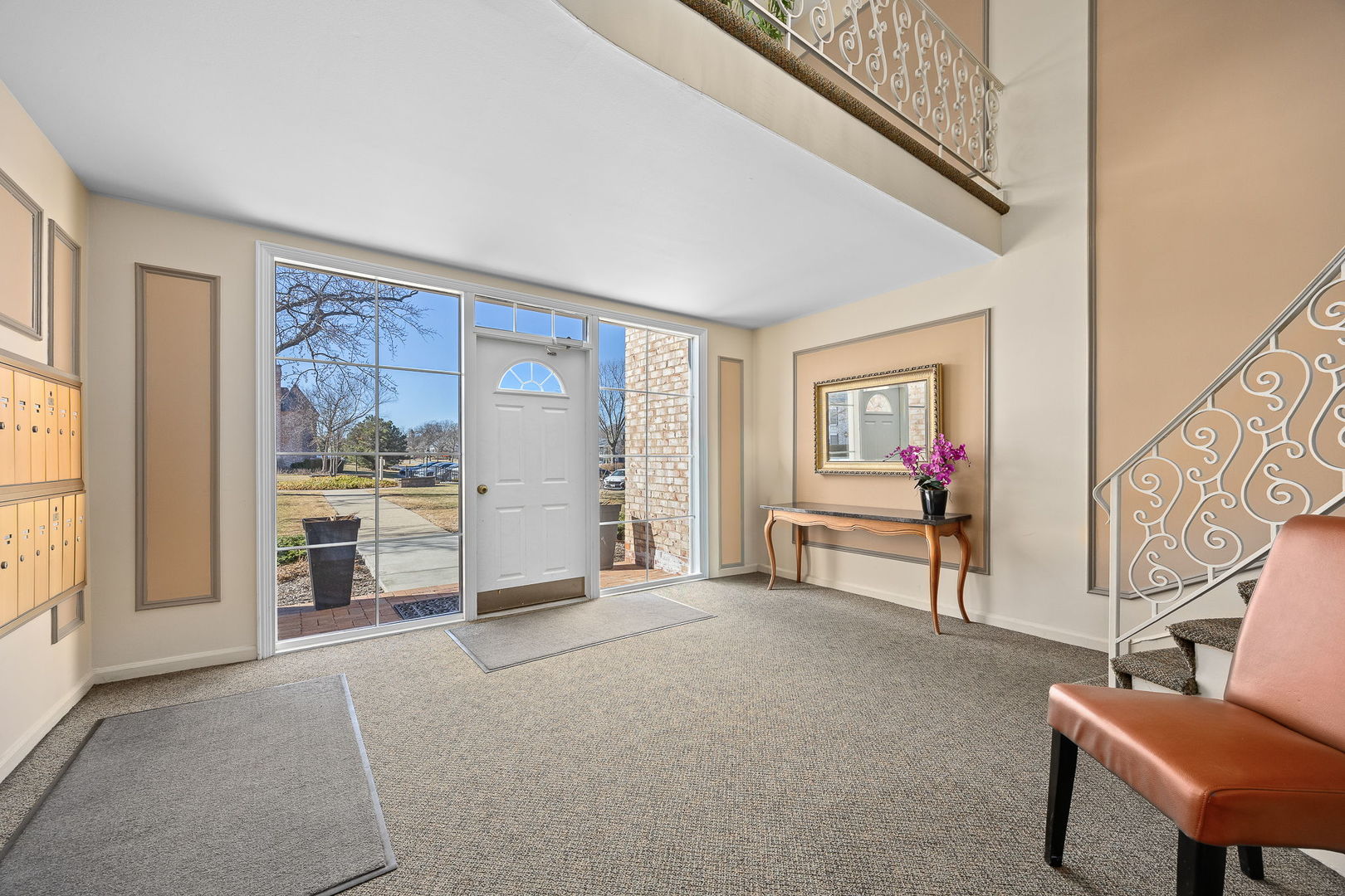 140 Carriage Way Drive, Unit C218 Burr Ridge, IL 60527 - Photo 28 of 33 a living room with furniture and a large window