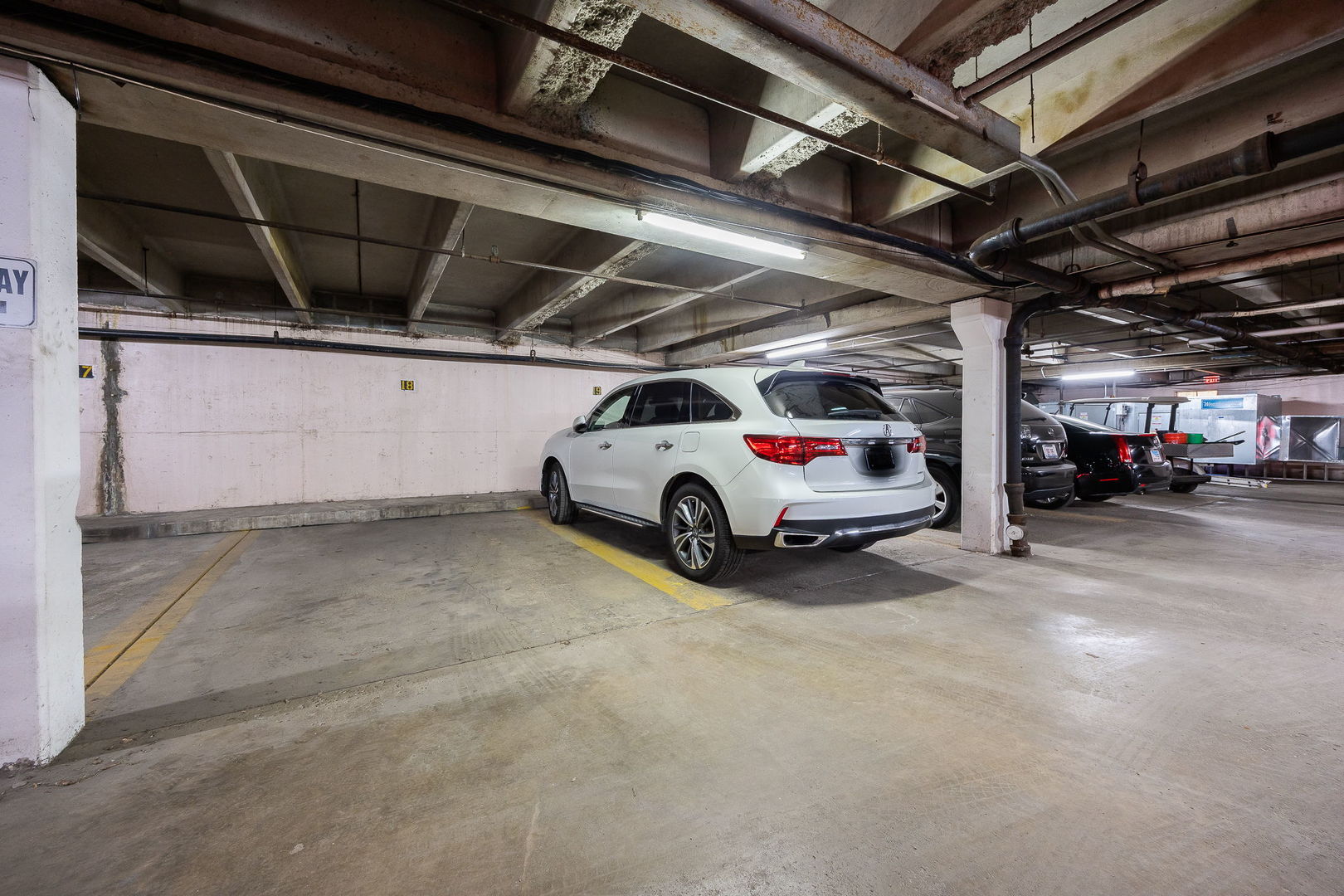 140 Carriage Way Drive, Unit C218 Burr Ridge, IL 60527 - Photo 33 of 33 a view of cars parked in a parking