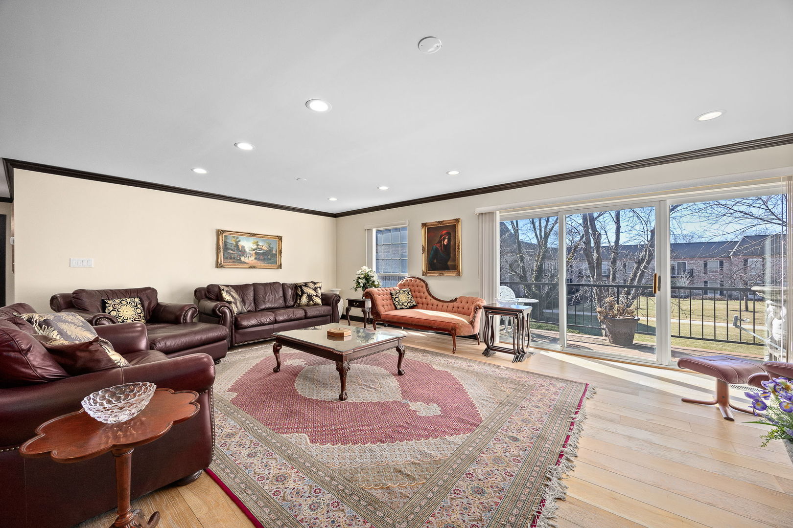 140 Carriage Way Drive, Unit C218 Burr Ridge, IL 60527 - Photo 4 of 33 a living room with furniture and a large window