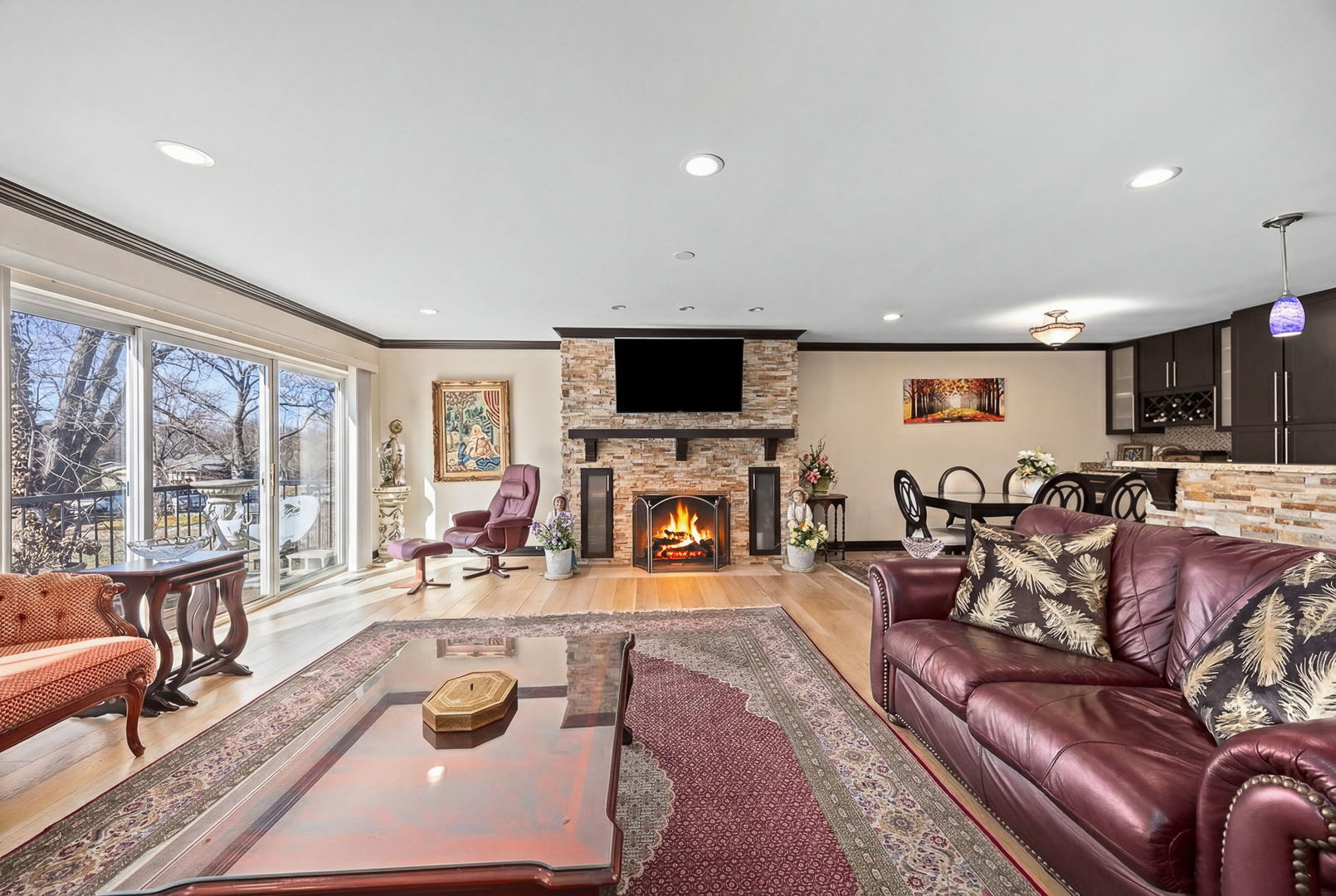 140 Carriage Way Drive, Unit C218 Burr Ridge, IL 60527 - Photo 5 of 33 a living room with fireplace furniture and a large window