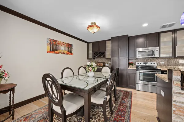 a dining room with furniture and chandelier