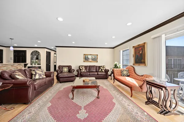 a living room with furniture or couch and a large window