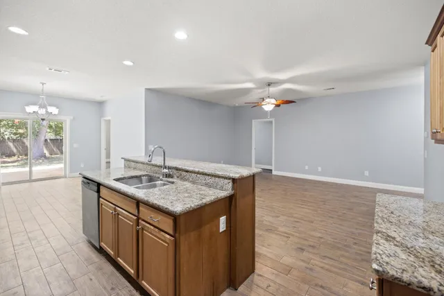 a kitchen that has a lot of cabinets in it