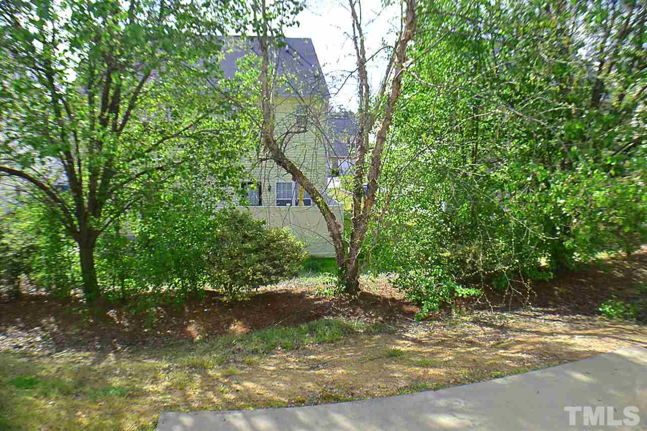 2149 Metacomet Way Raleigh, NC 27604 - Photo 11 of 11 a view of a yard with a tree
