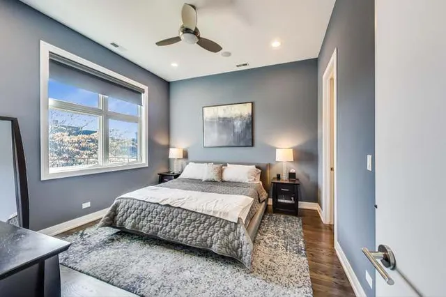 a bedroom with a bed and window