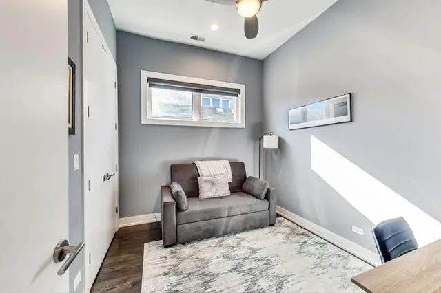 a living room with furniture and a rug