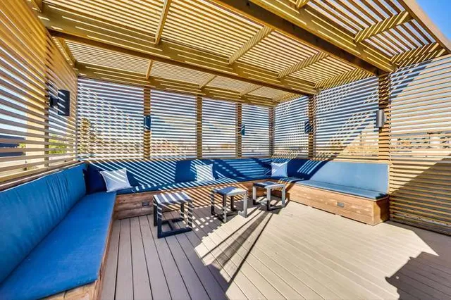 a view of a roof deck with wooden floor