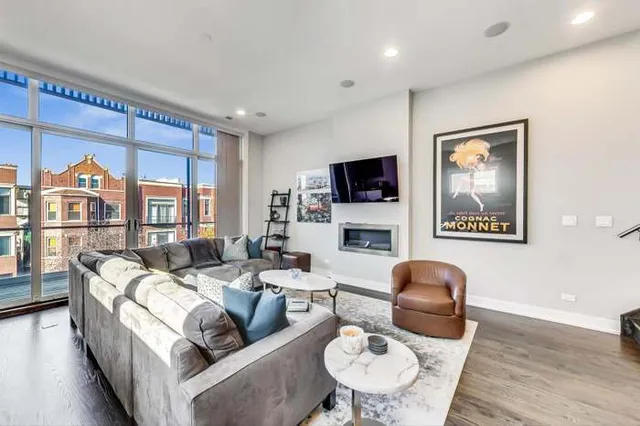 a living room with furniture fireplace and flat screen tv