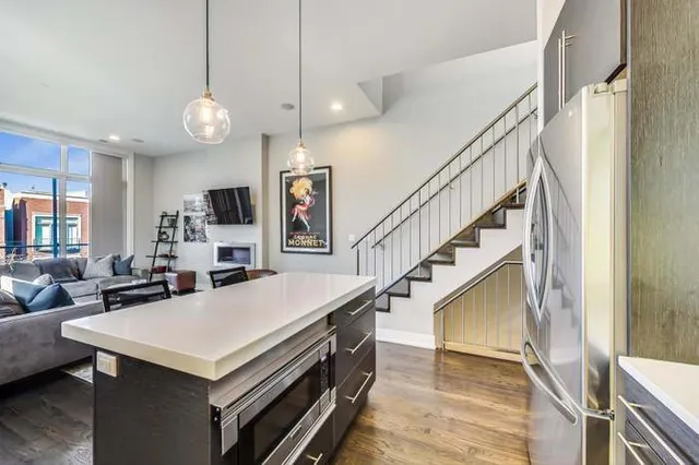 a view of kitchen island with furniture and wooden floor