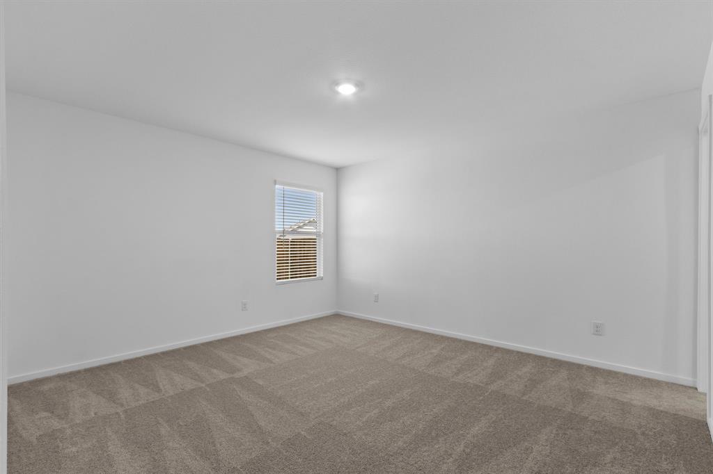 11333 Rodeo Drive Providence Village, TX 76227 - Photo 16 of 39 a view of an empty room with a window