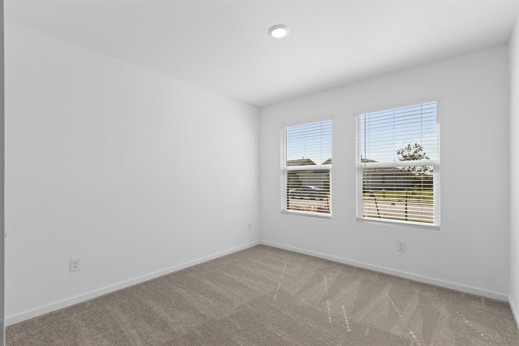 11333 Rodeo Drive Providence Village, TX 76227 - Photo 19 of 39 an empty room with a window