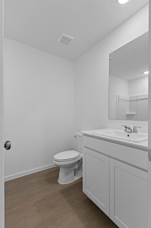 11333 Rodeo Drive Providence Village, TX 76227 - Photo 21 of 39 a bathroom with a sink a toilet and mirror