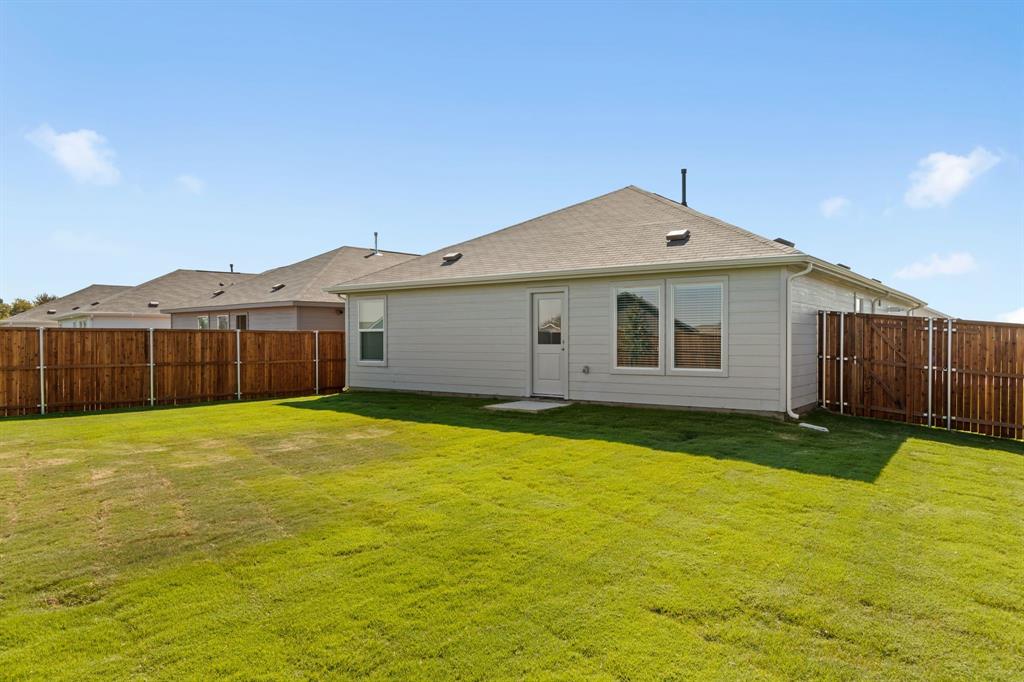 11333 Rodeo Drive Providence Village, TX 76227 - Photo 23 of 39 a big house with wooden fence