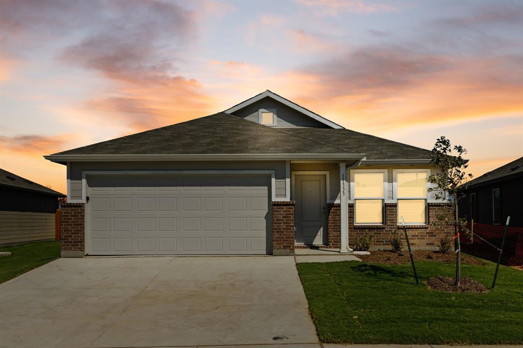 11333 Rodeo Drive Providence Village, TX 76227 - Photo 26 of 39 a front view of house with a garden