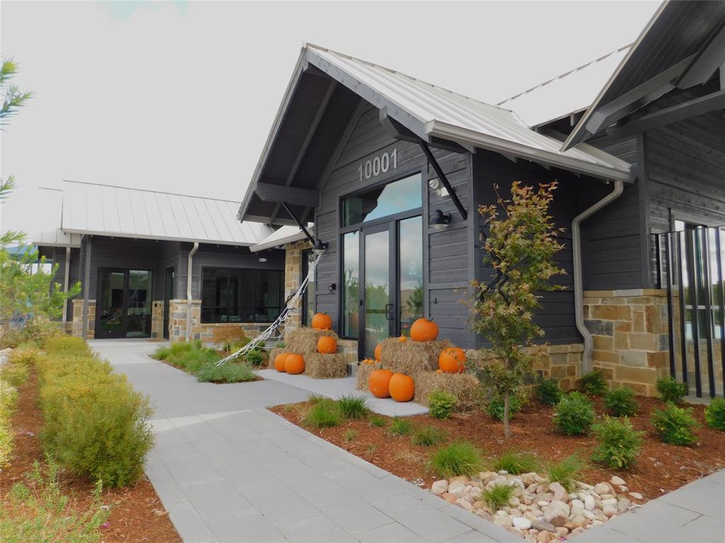 11333 Rodeo Drive Providence Village, TX 76227 - Photo 32 of 39 a view of a house with backyard outdoor seating area and porch