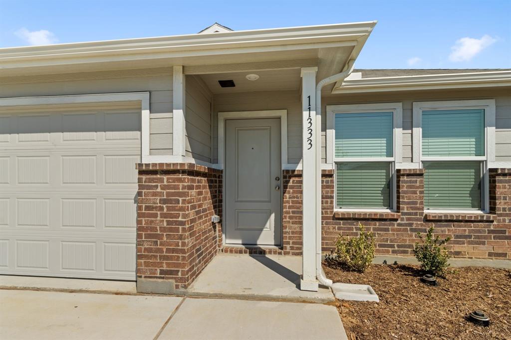 11333 Rodeo Drive Providence Village, TX 76227 - Photo 4 of 39 a view of front door of a house