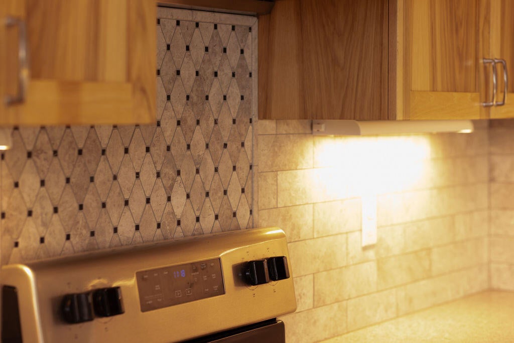 23775 Dodds Road Bend, OR 97701 - Photo 18 of 67 Under cabinet lighting throughout kitchen.