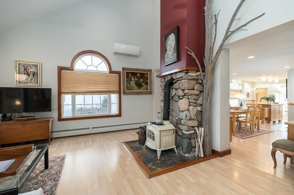8 Rio Drive Gloucester, MA 01930 - Photo 11 of 33 a living room with furniture and a flat screen tv