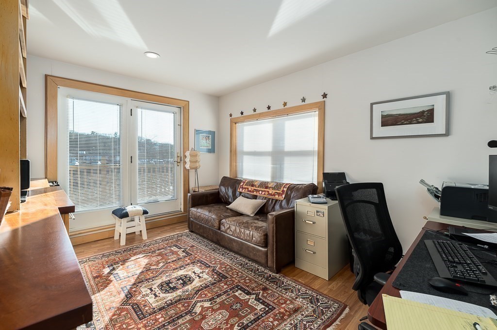 8 Rio Drive Gloucester, MA 01930 - Photo 22 of 33 a living room with furniture and a floor to ceiling window