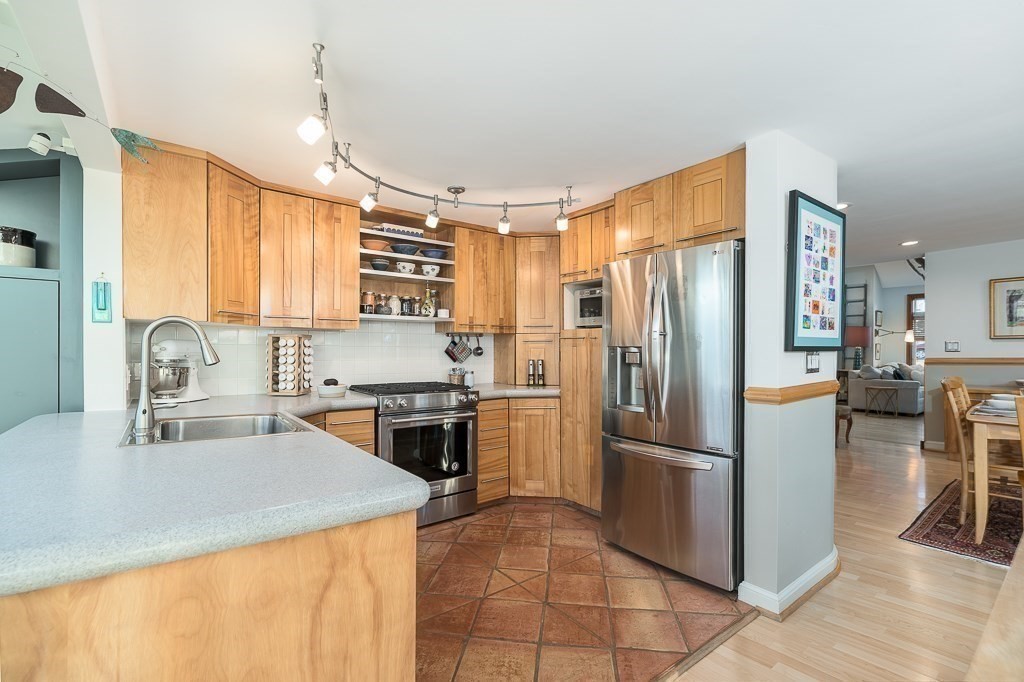 8 Rio Drive Gloucester, MA 01930 - Photo 6 of 33 a kitchen with a refrigerator a stove a sink and a counter
