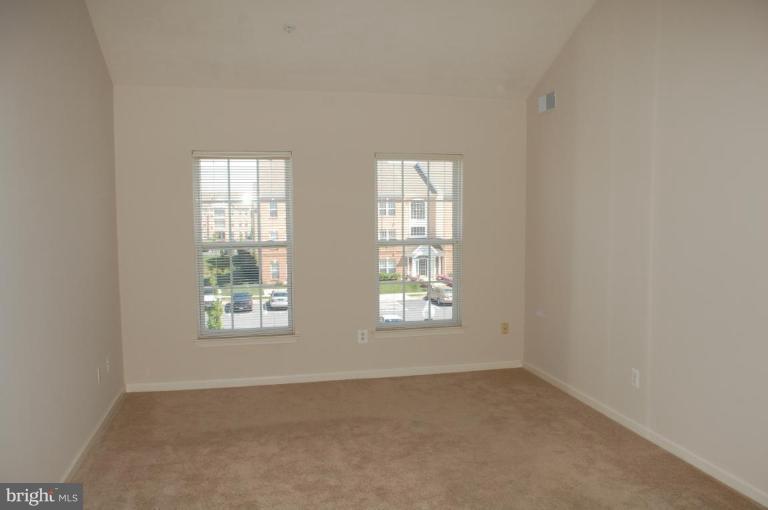 5238 Glenthorne Court, Unit 5238 Rosedale, MD 21237 - Photo 13 of 14 an empty room with windows