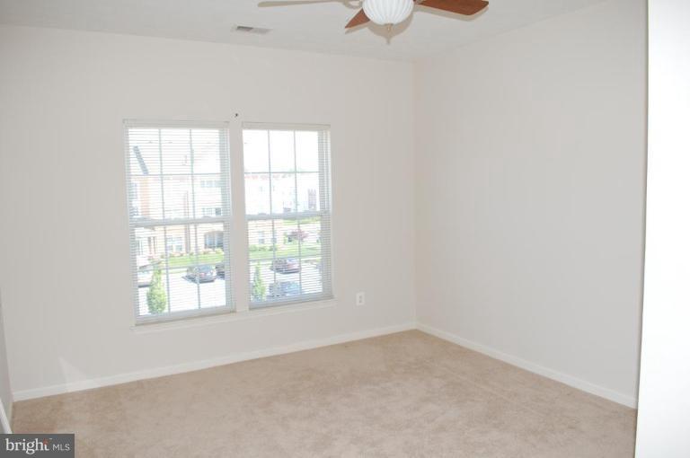 5238 Glenthorne Court, Unit 5238 Rosedale, MD 21237 - Photo 14 of 14 an empty room with a window