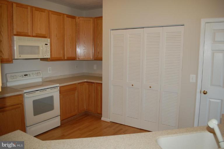 5238 Glenthorne Court, Unit 5238 Rosedale, MD 21237 - Photo 5 of 14 a bathroom with a sink a toilet and shower