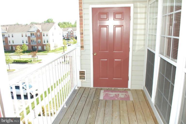 5238 Glenthorne Court, Unit 5238 Rosedale, MD 21237 - Photo 7 of 14 a view of balcony with wooden floor