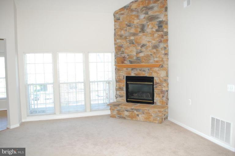 5238 Glenthorne Court, Unit 5238 Rosedale, MD 21237 - Photo 10 of 14 an empty room with windows
