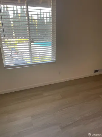 a view of a room that has a window in it