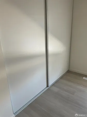 an empty room with wooden floor