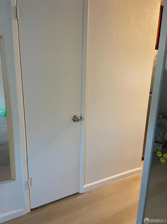 an empty room with wooden floor