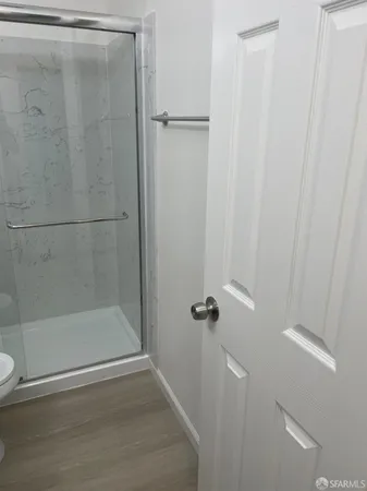 a bathroom with a glass shower door