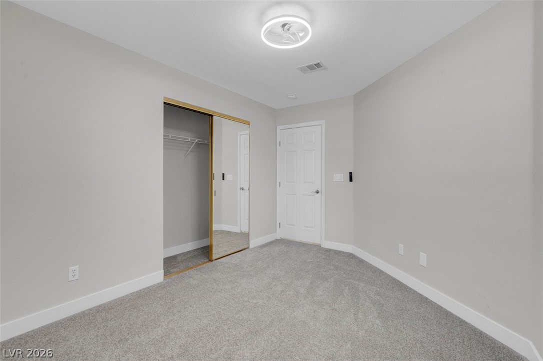 3604 North Campbell Road Las Vegas, NV 89129 - Photo 41 of 54 Unfurnished bedroom with carpet, baseboards, and a closet