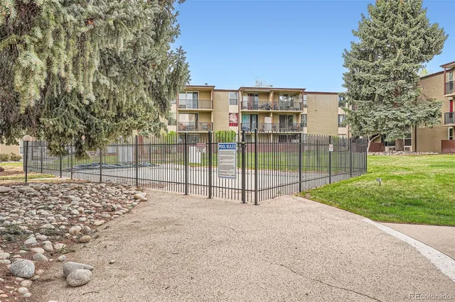 a view of a backyard with large trees