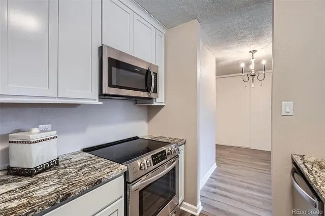 a kitchen with a stove and a microwave