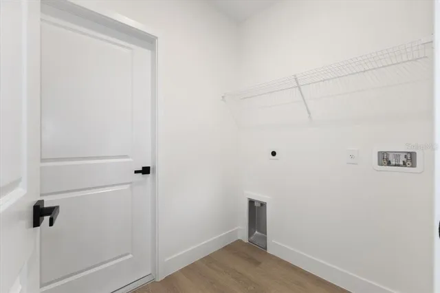 a view of a floor to ceiling window and a lake view