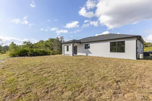 a view of a lake with houses in the back