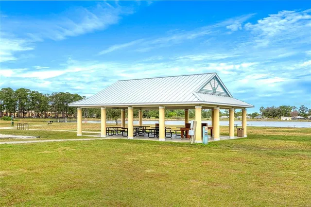 a view of swimming pool with outdoor seating
