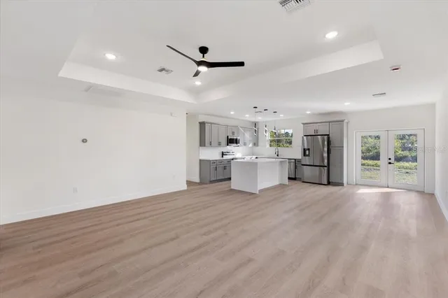 a view of a kitchen with wooden floor