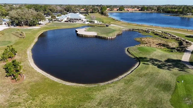 an aerial view of a swimming pool and outdoor space