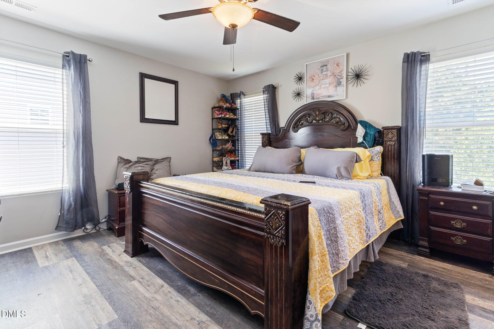 3713 Marshlane Way Raleigh, NC 27610 - Photo 18 of 38 a bedroom with a bed and a chandelier