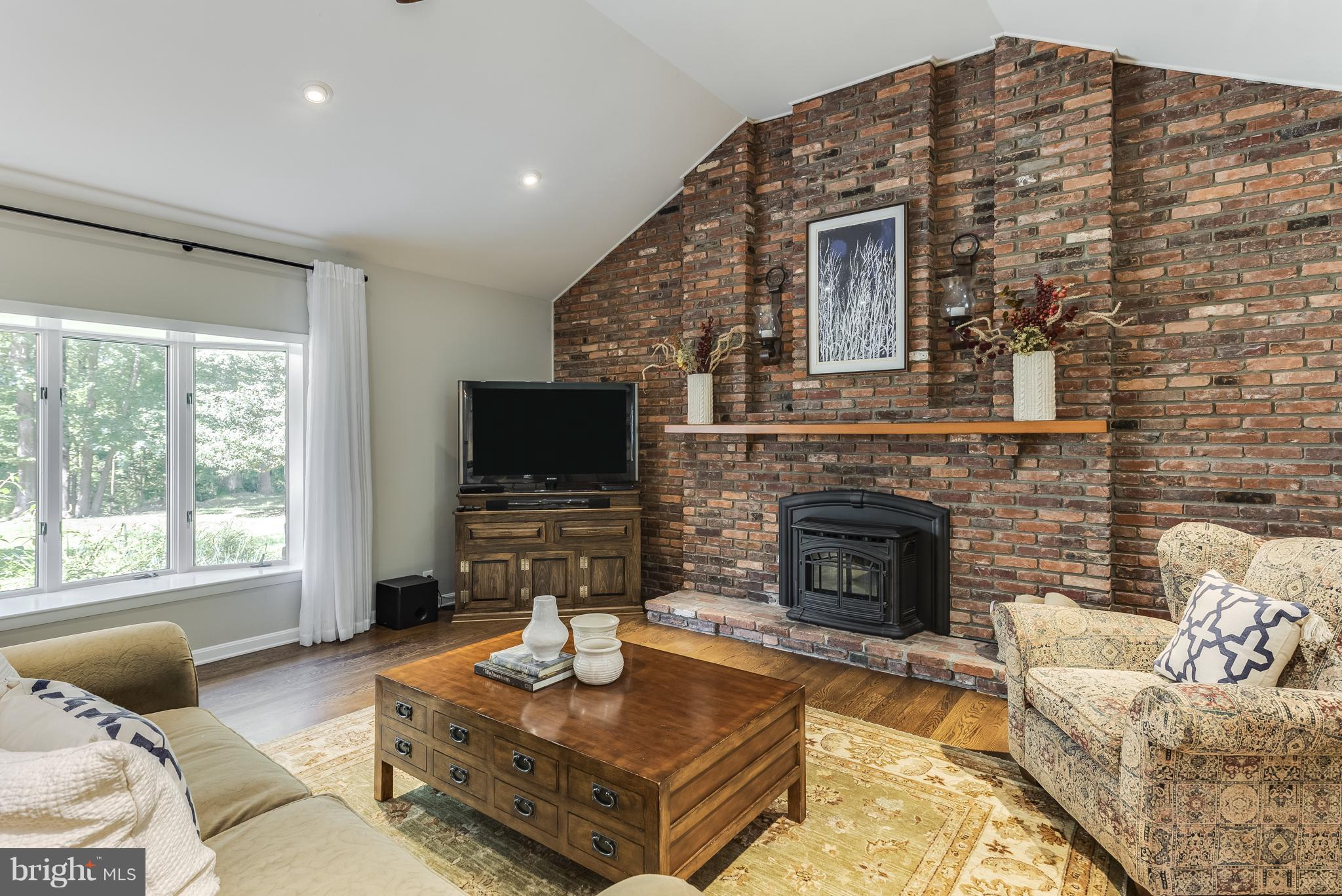 240 Old Mill Bottom Road South Annapolis, MD 21409 - Photo 9 of 30 Sunny Living room with Pellet Stove