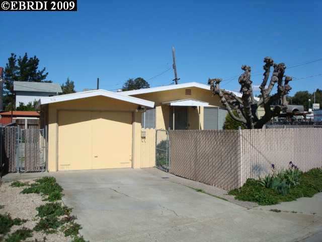 510 Seventh Street Rodeo, CA 94572 - Photo 1 of 1 a view of a house with a yard and potted plants
