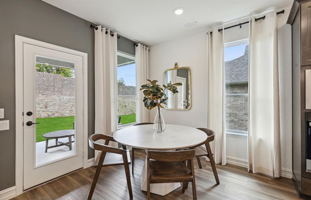 4708 Ripley Court Celina, TX 75009 - Photo 7 of 18 *Model Representation - Dining area off kitchen with large windows