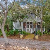 a view of a house with backyard and garden