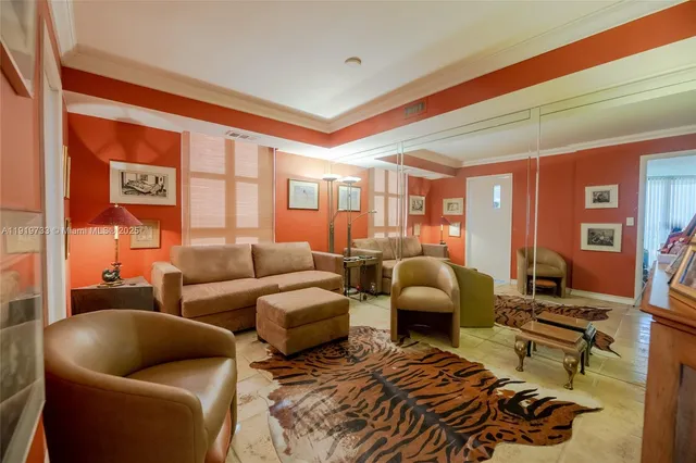 a view of a big room with wooden floor and windows