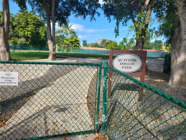 a childrens park with lots of swings and slides