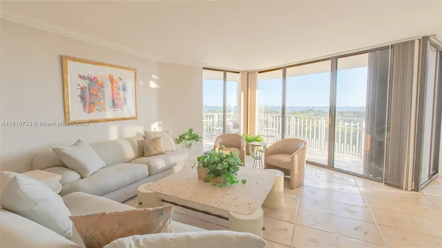 a view of an empty room with windows and balcony